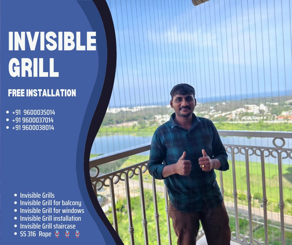Man giving thumbs up on a high-rise balcony with vertical invisible grills overlooking water, greenery, and distant buildings.